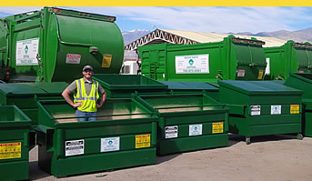 man standing in green dumpster - pay bill online