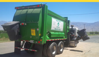 picture of green dump truck - about bishop waste